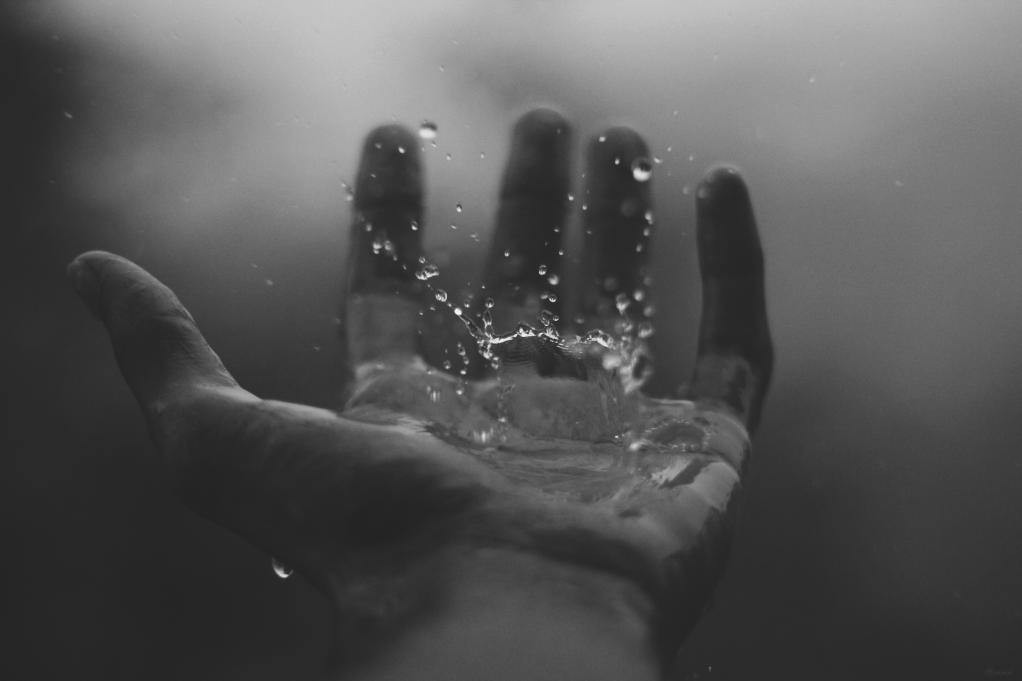 a raindrop on a hand