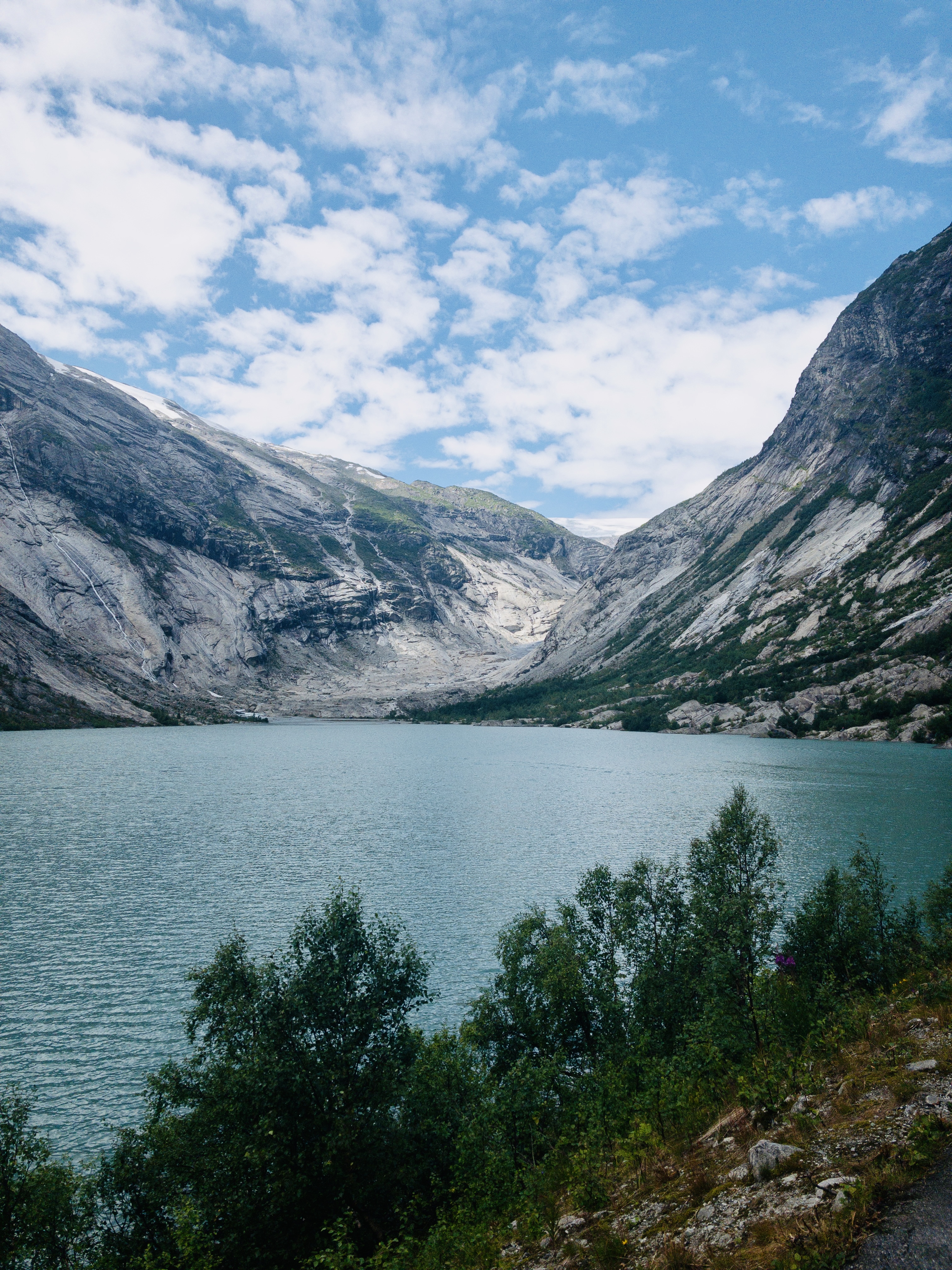 A part of the Norwegian Fjords with mountains and a idyllic ocean.