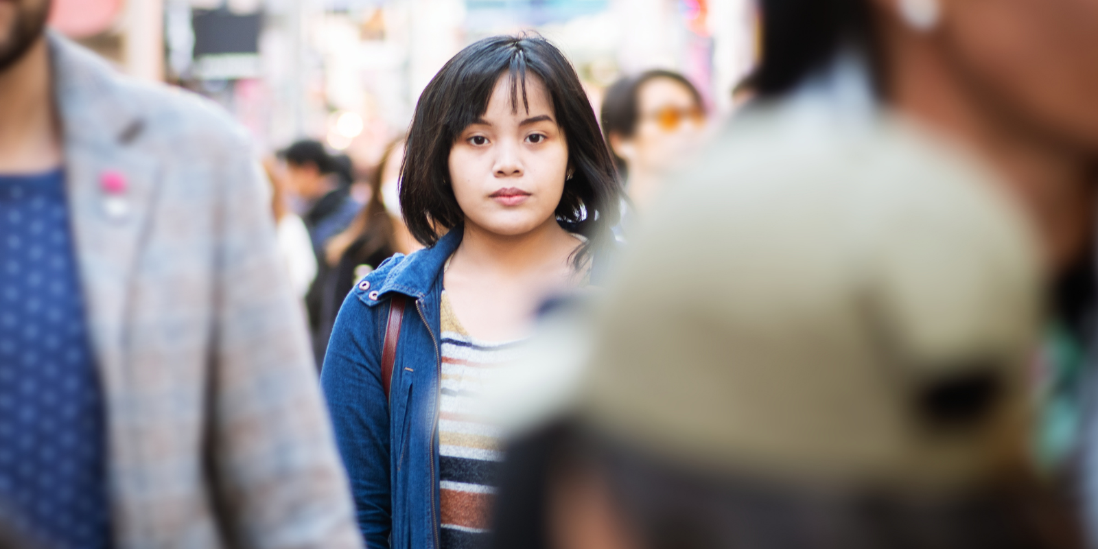 woman standing in a crowd