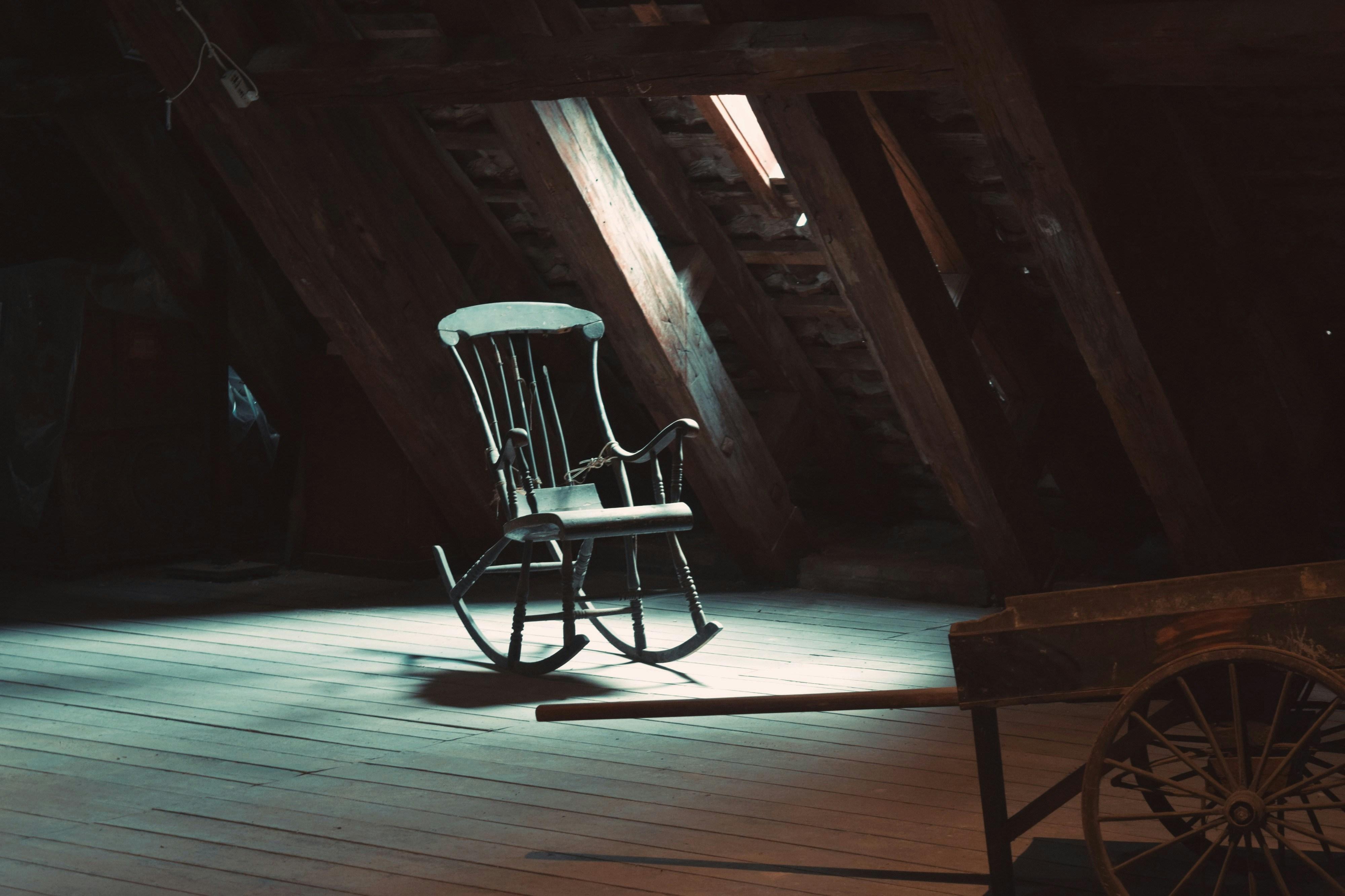 an old rocking chair in an attic