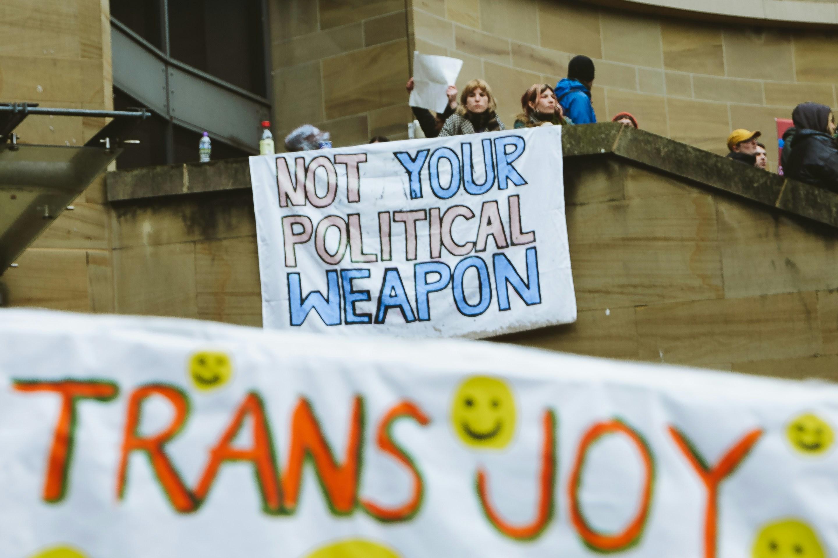 sign that reads "Not your political weapon"