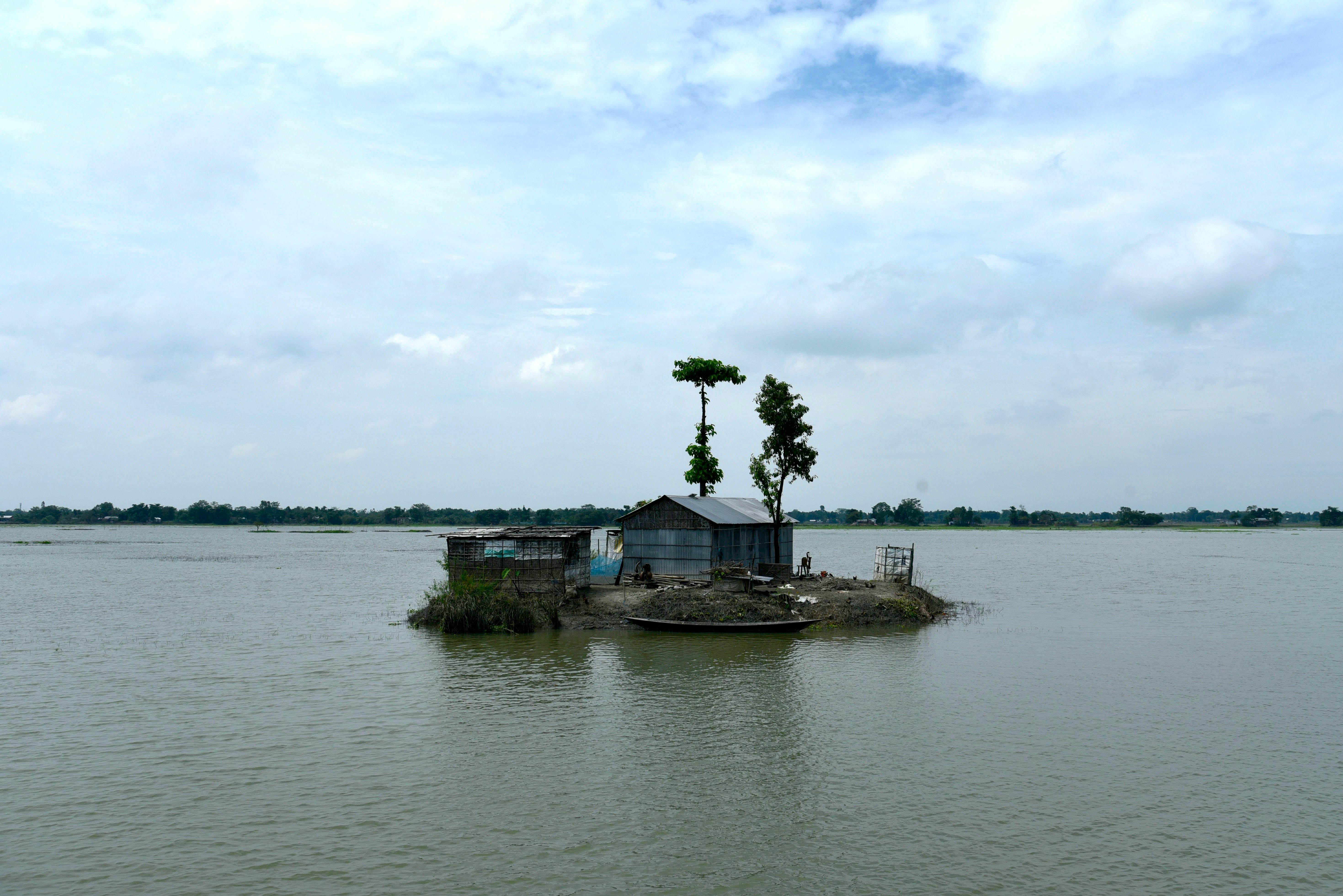 flooded field with a home in the middle 