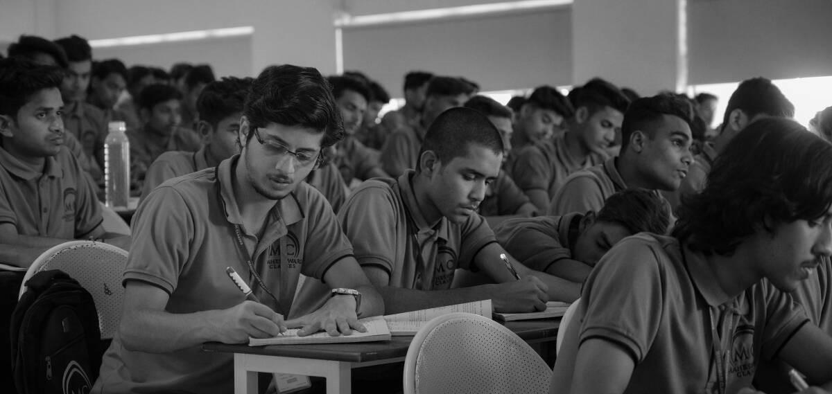 screenshot from the show Kota Factory - Black and white scene of students in a classroom