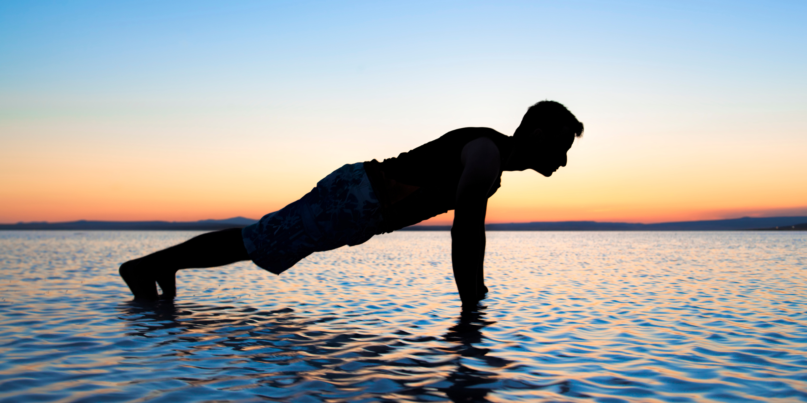 person planking in the ocean