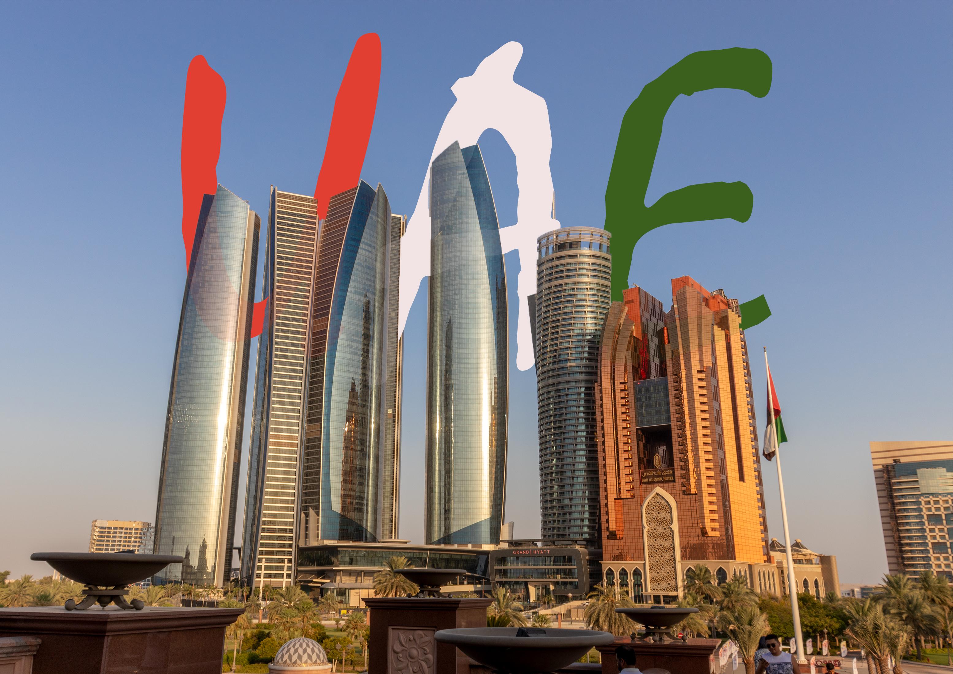  towers of Abu Dhabi with the letters UAE written behind them
