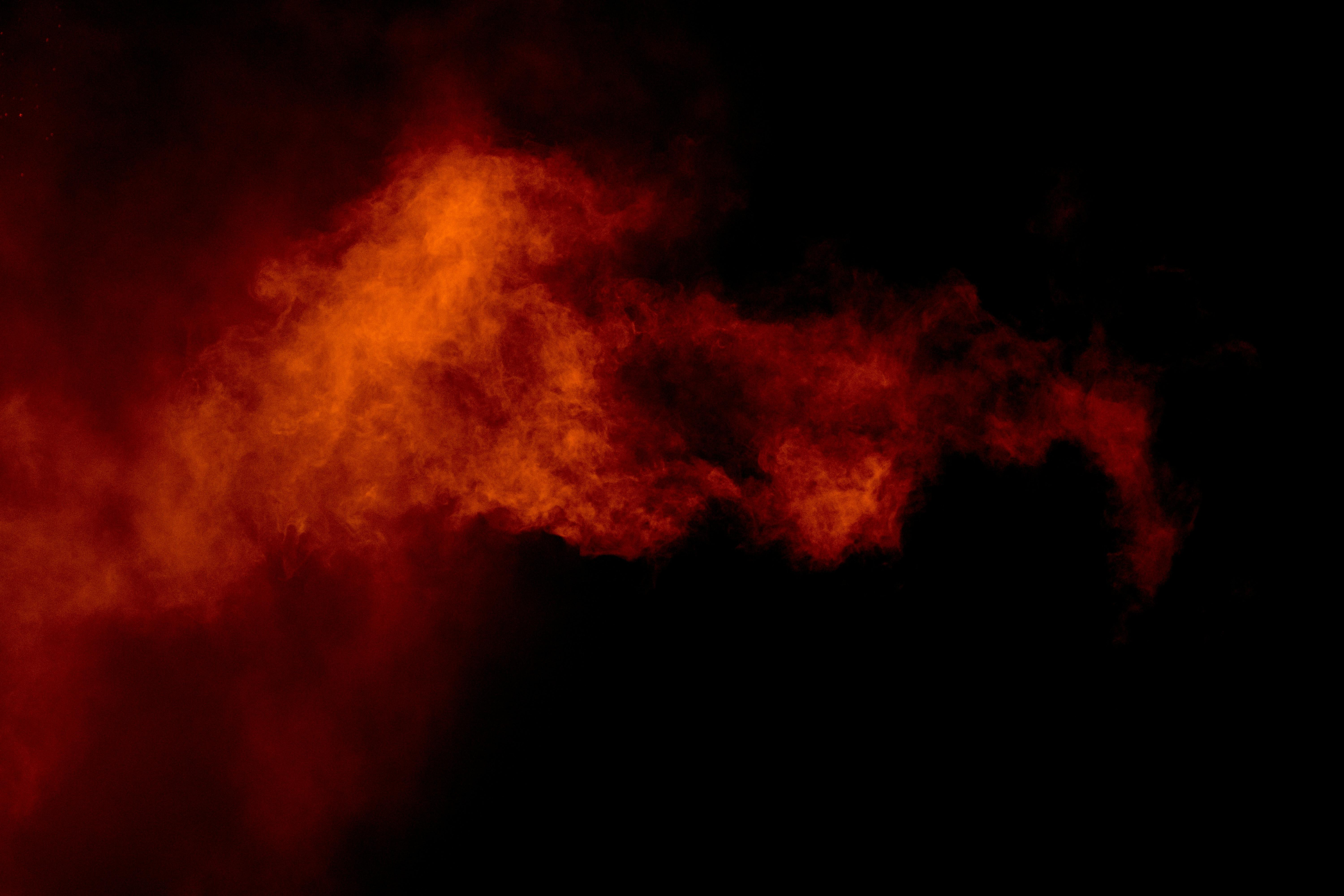 red smoke on a black background