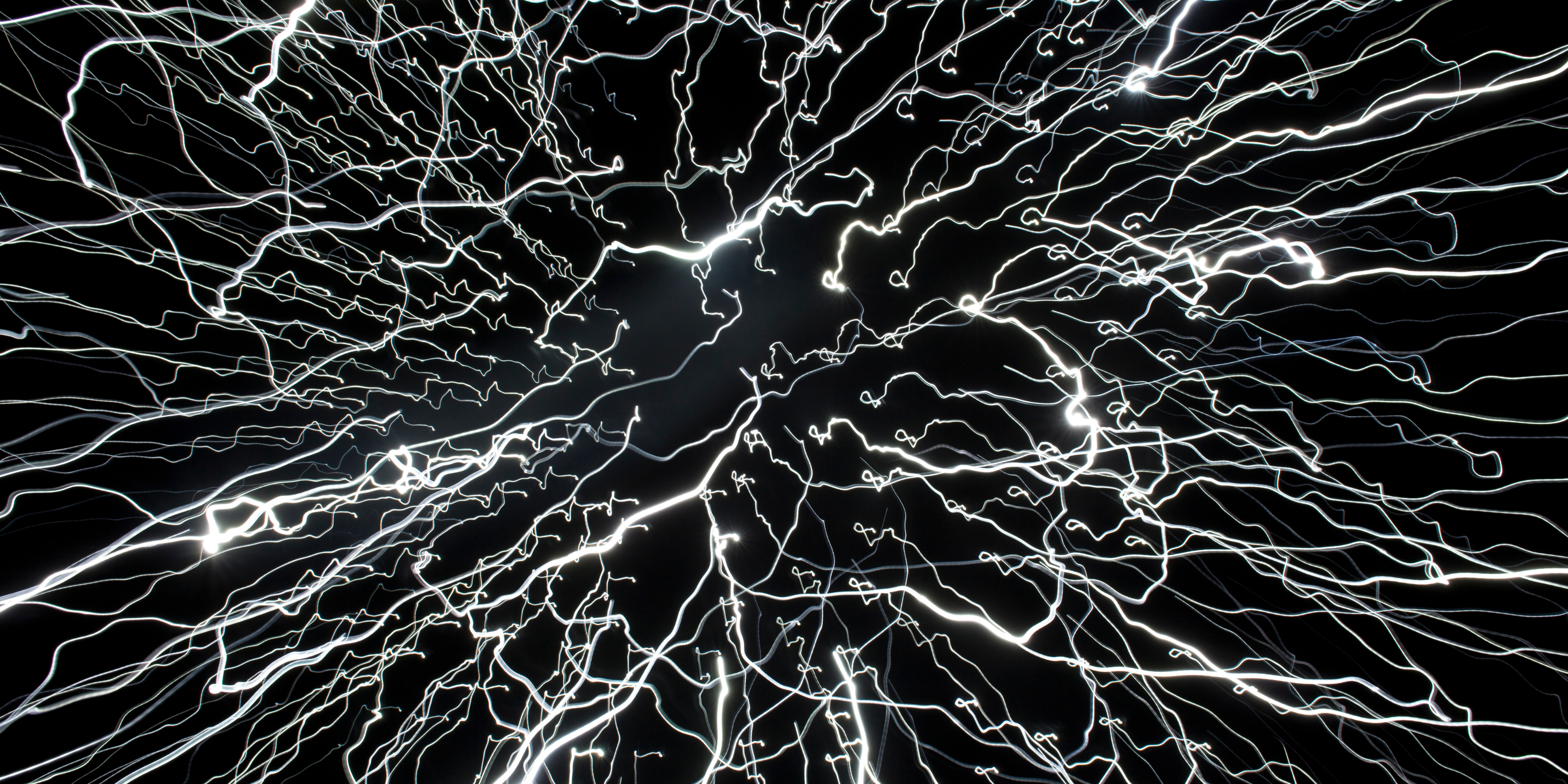 white glowing streaks on a black background