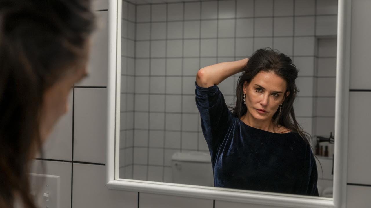 Demi More Looking at herself in the mirror in the movie The Substance