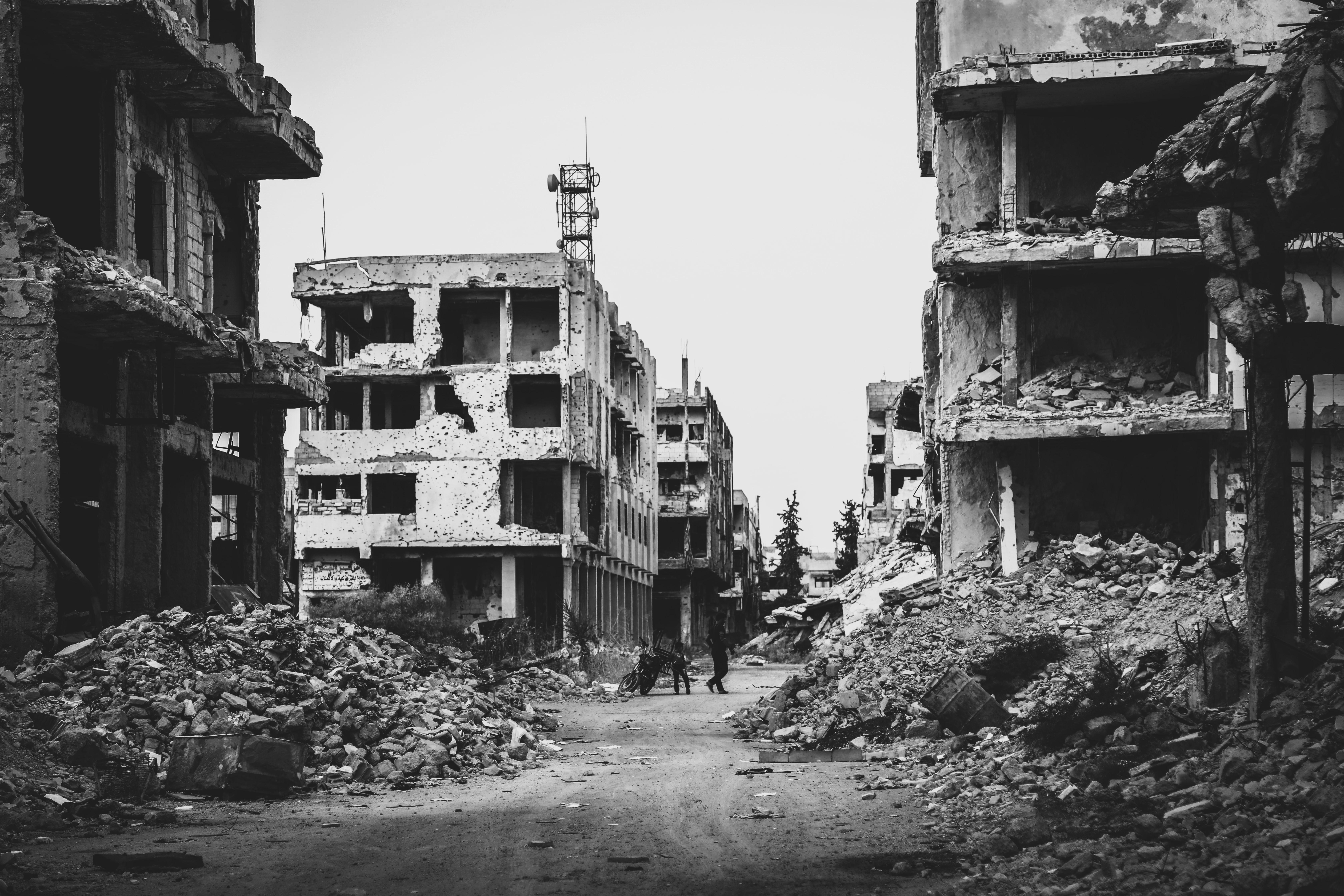 black and white image of rubble of buildings 