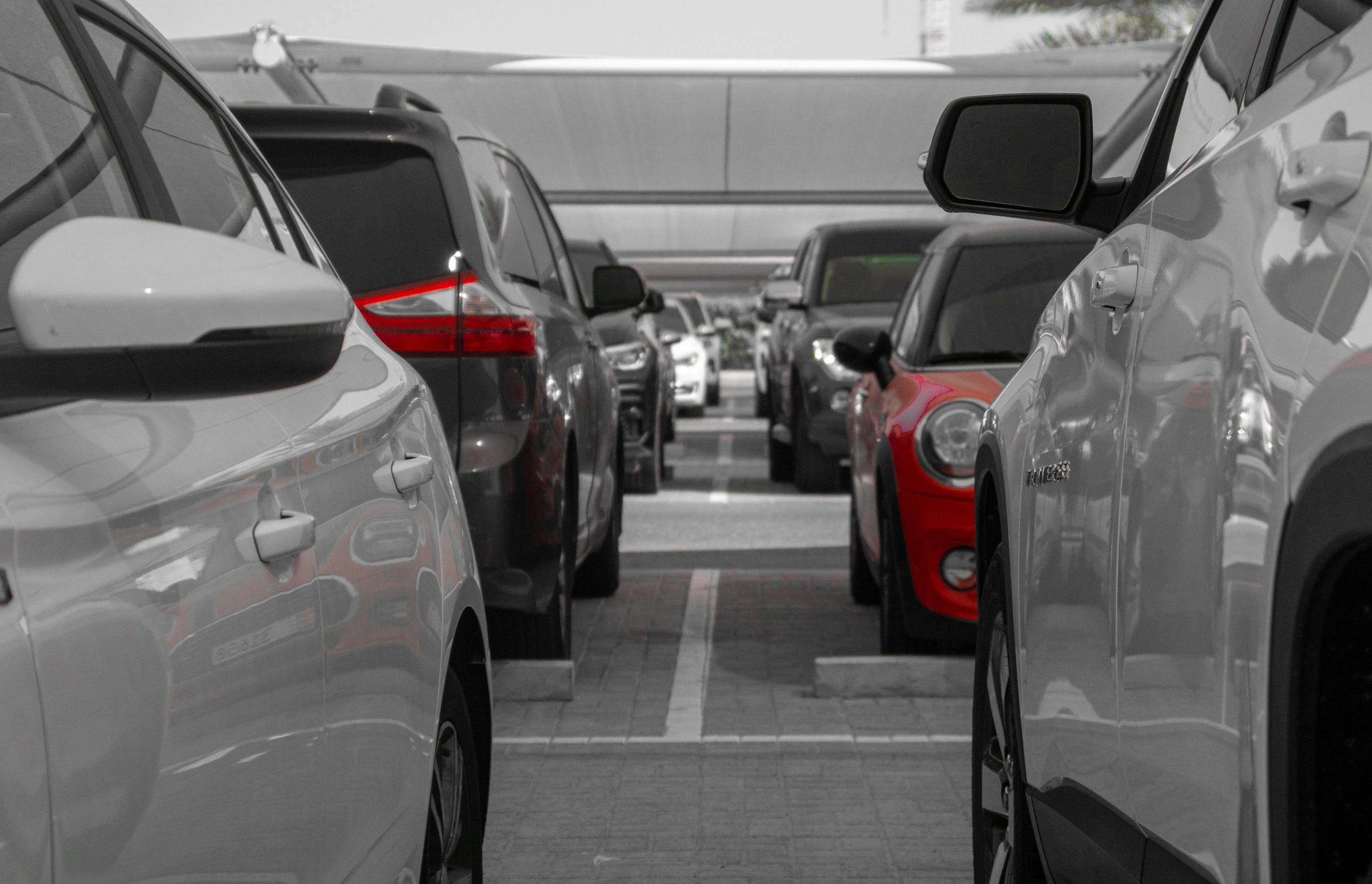 red cars against a monochrome background