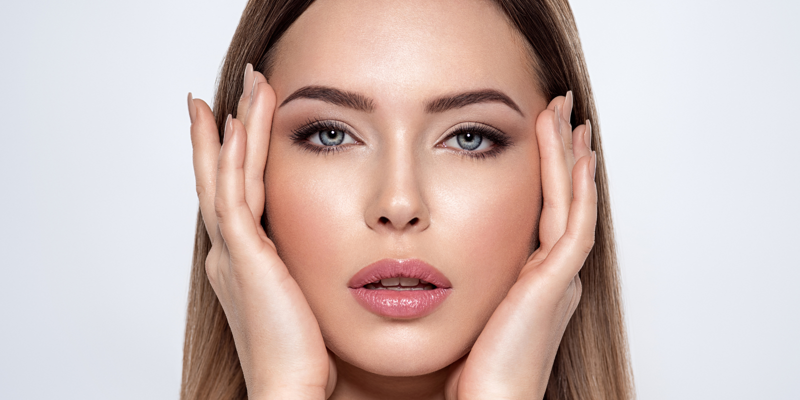 Woman with glam makeup looking into camera