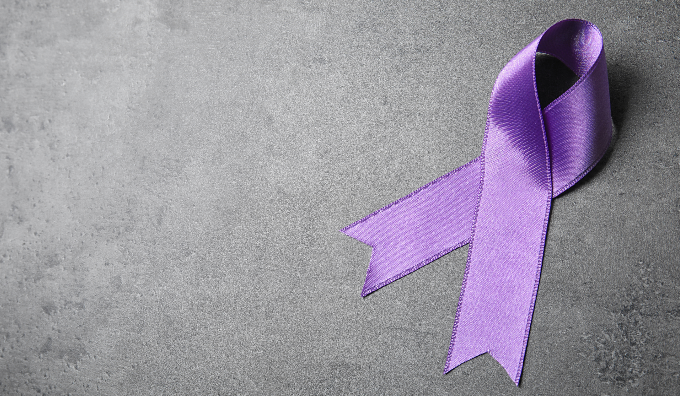 a purple ribbon on a gray background