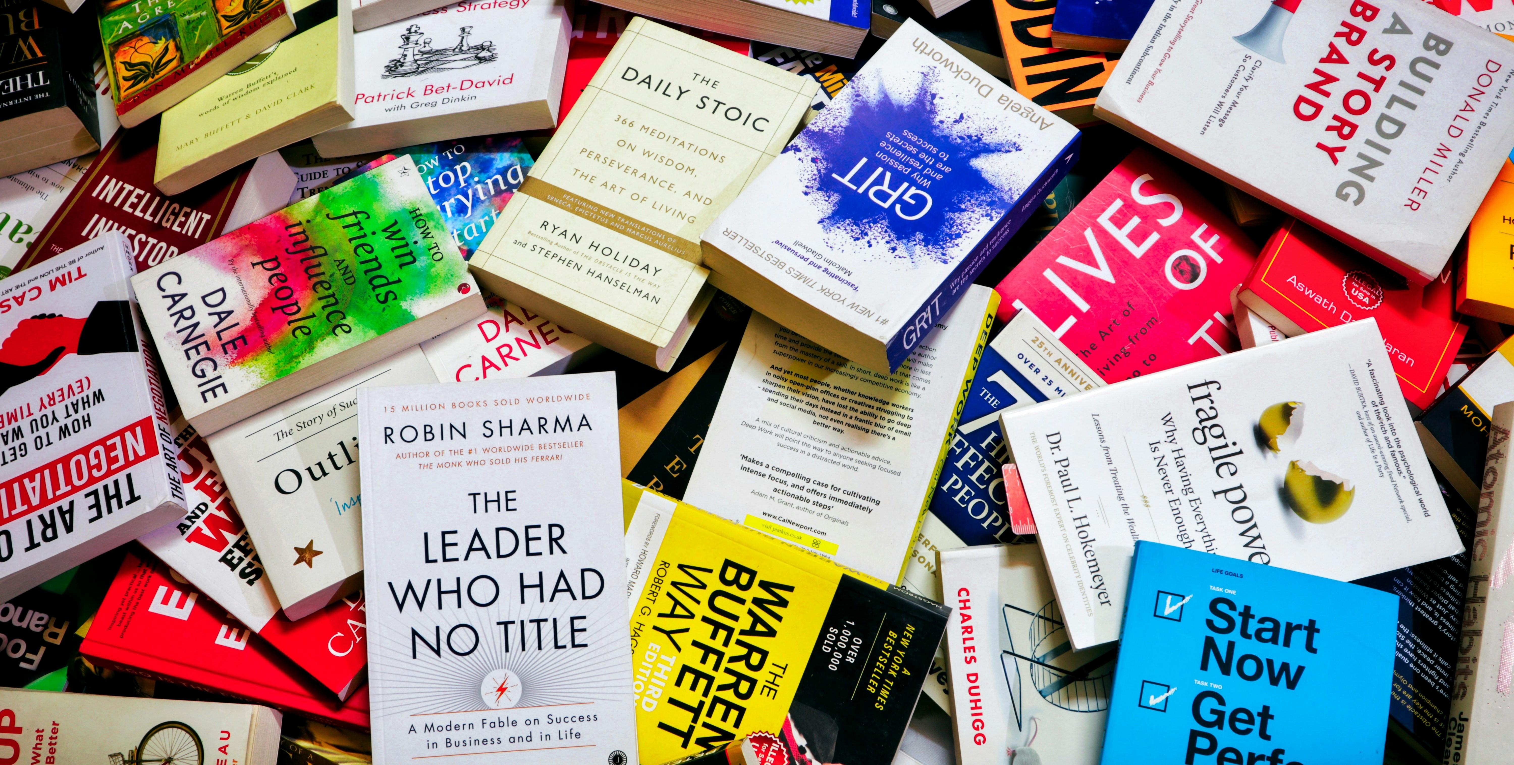 a pile of self help books 