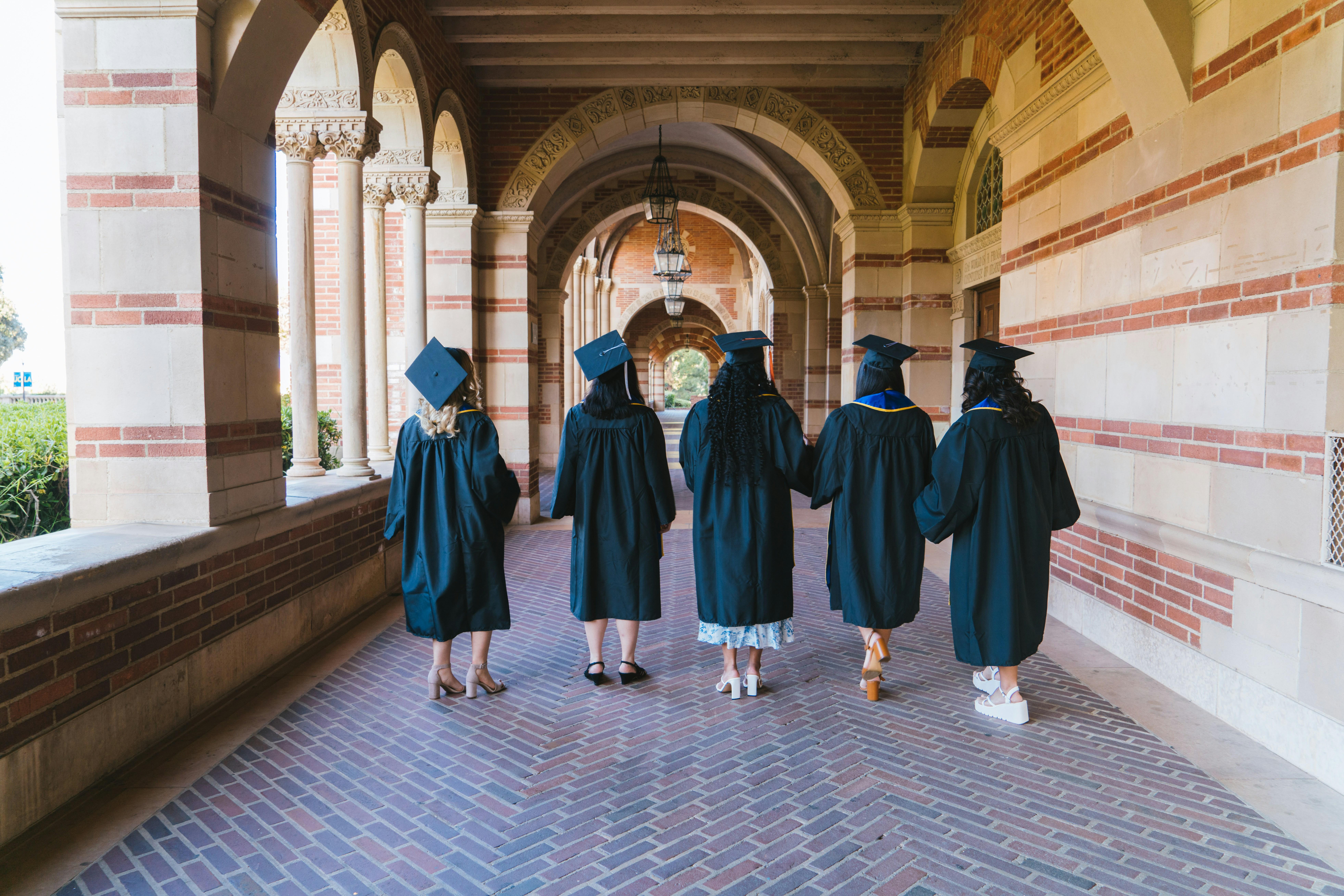 Five women graduating from college. 