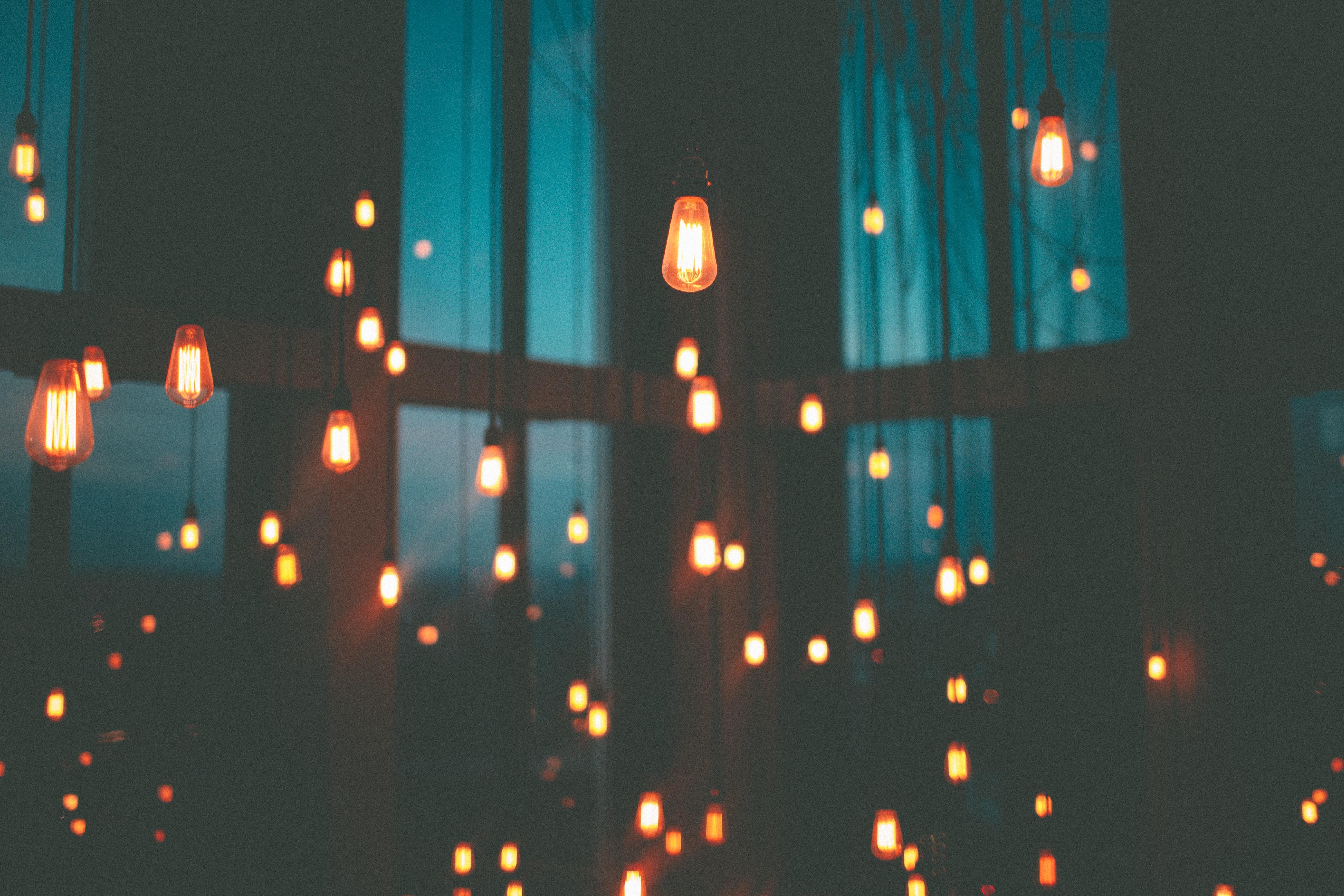 room with lightbulbs hanging from the ceiling