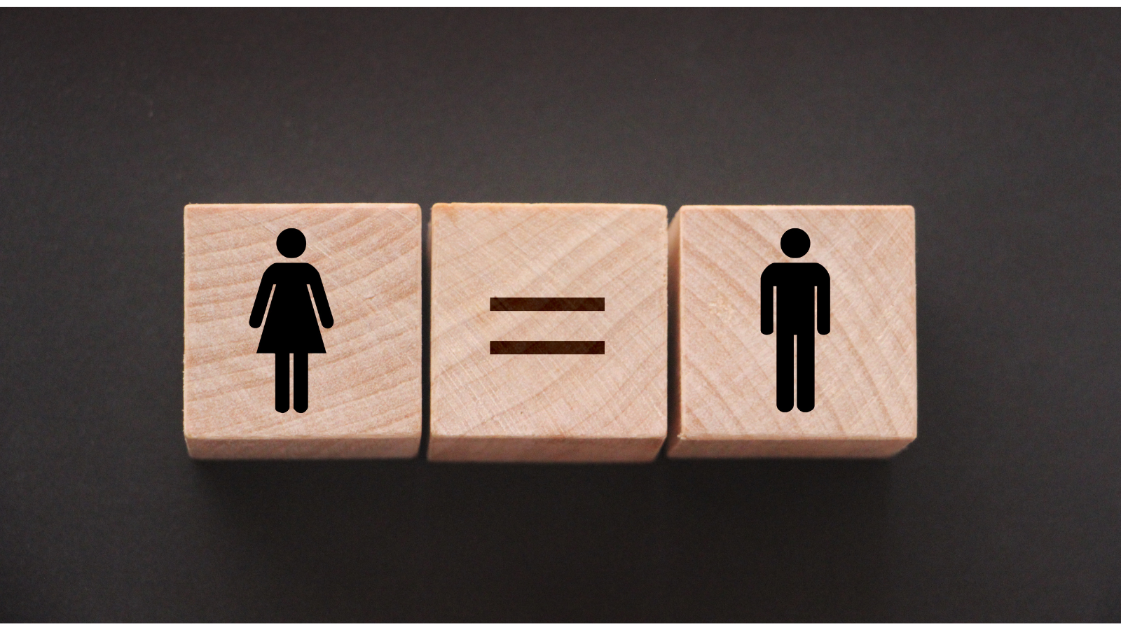 Wooden blocks with man and woman symbols on them