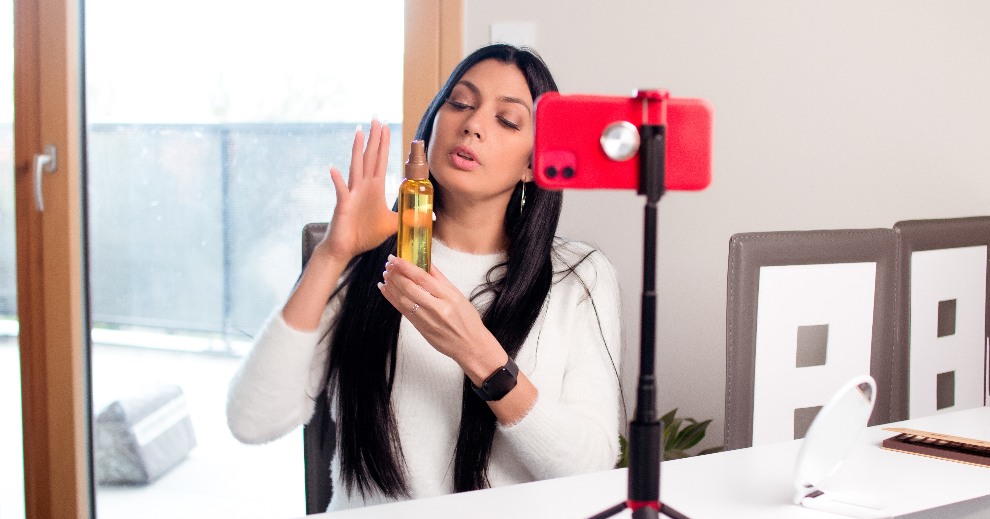 woman creating a video showing off a product