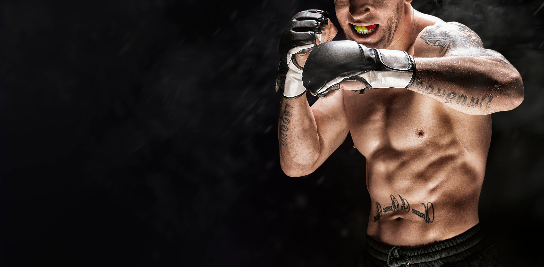 UFC fighter with fists up on a black background