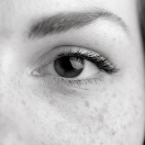 a closeup of a woman's eyes in grayscale