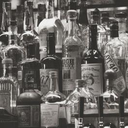 black and white image of alcohol bottles