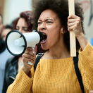 woman yelling in to a megaphone