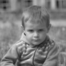 gray scale photo of a little boy pouting
