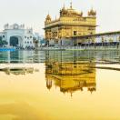 a temple and its reflection in the water