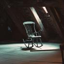 an old rocking chair in an attic