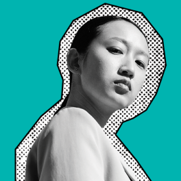 Person on a teal background with the text "Create Our Future"