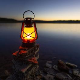 lantern on a stack of rocks