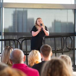 Molly doing a TEDx talk in the Senedd (Welsh Government)
