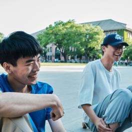 two teen boys laughing