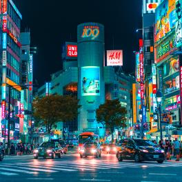 Busy street in japan with many neon signs