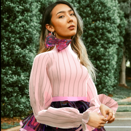 Woman wearing real clothes and digital clothes