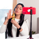 woman creating a video showing off a product