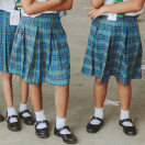 girls in school uniforms standing around