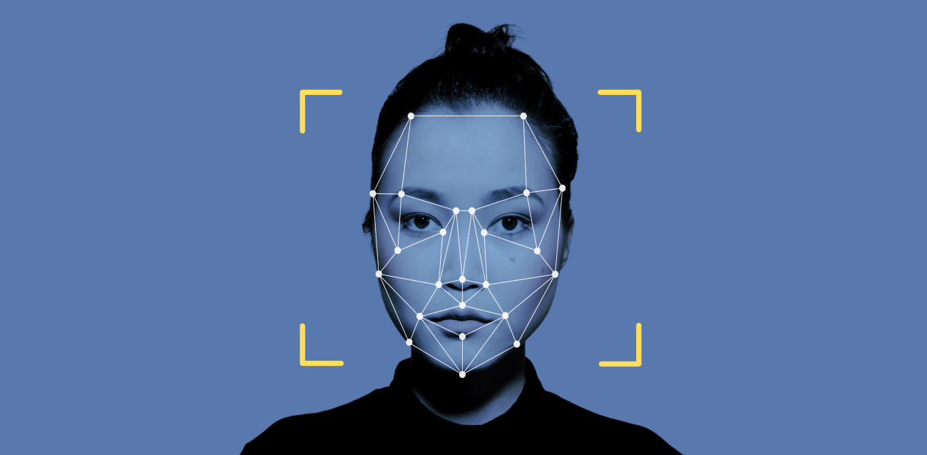 Woman's face with scan points overlaid on a blue background