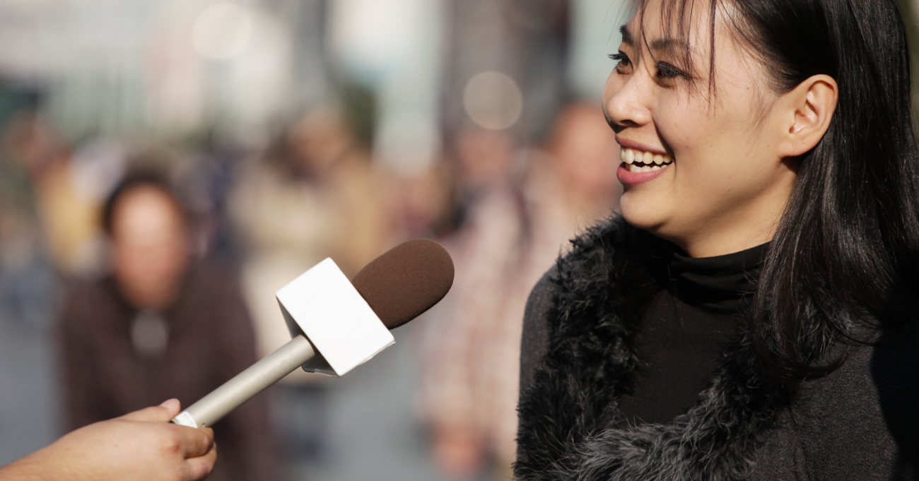 woman being interviewed on the street