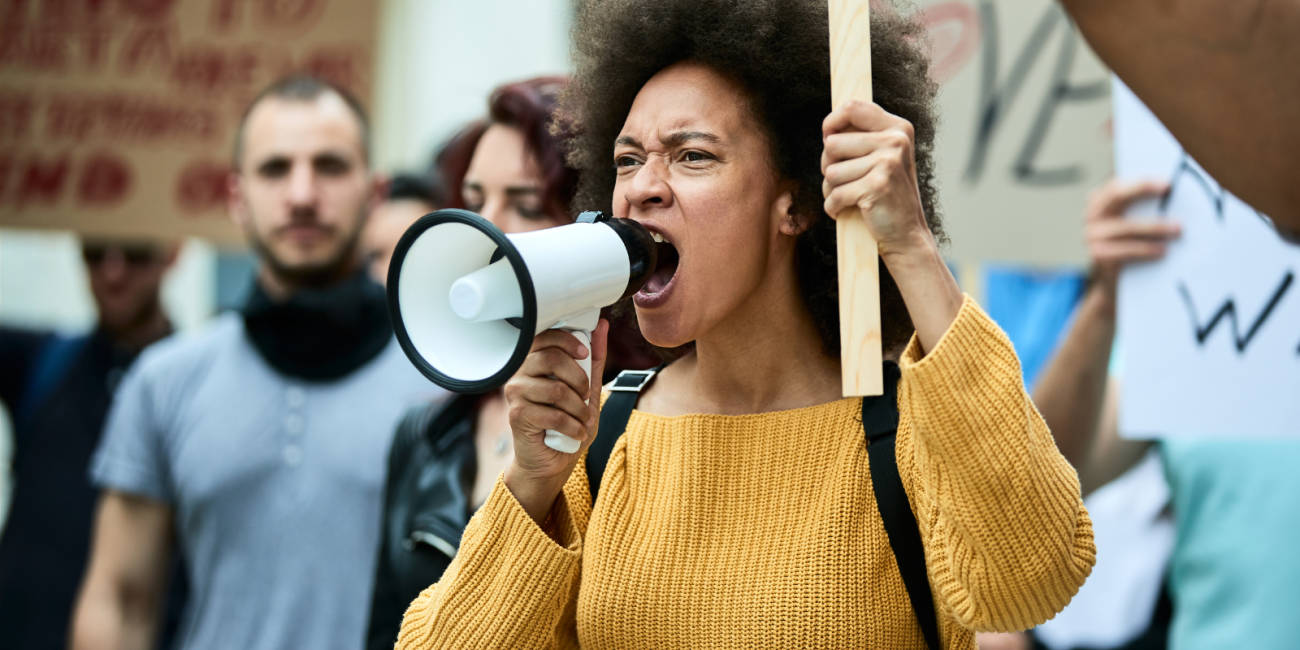 woman yelling in to a megaphone