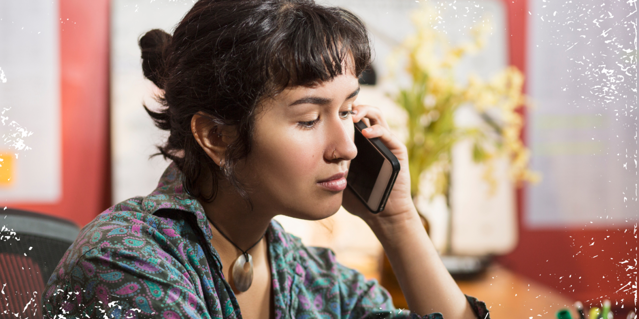 a young woman talking on an iphone