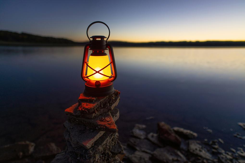 lantern on a stack of rocks
