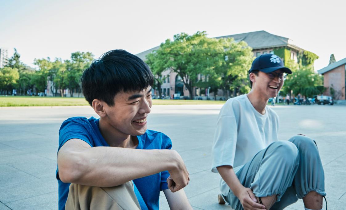 two teen boys laughing