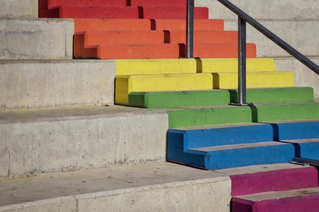 A set of steps in the pride flag colours.
