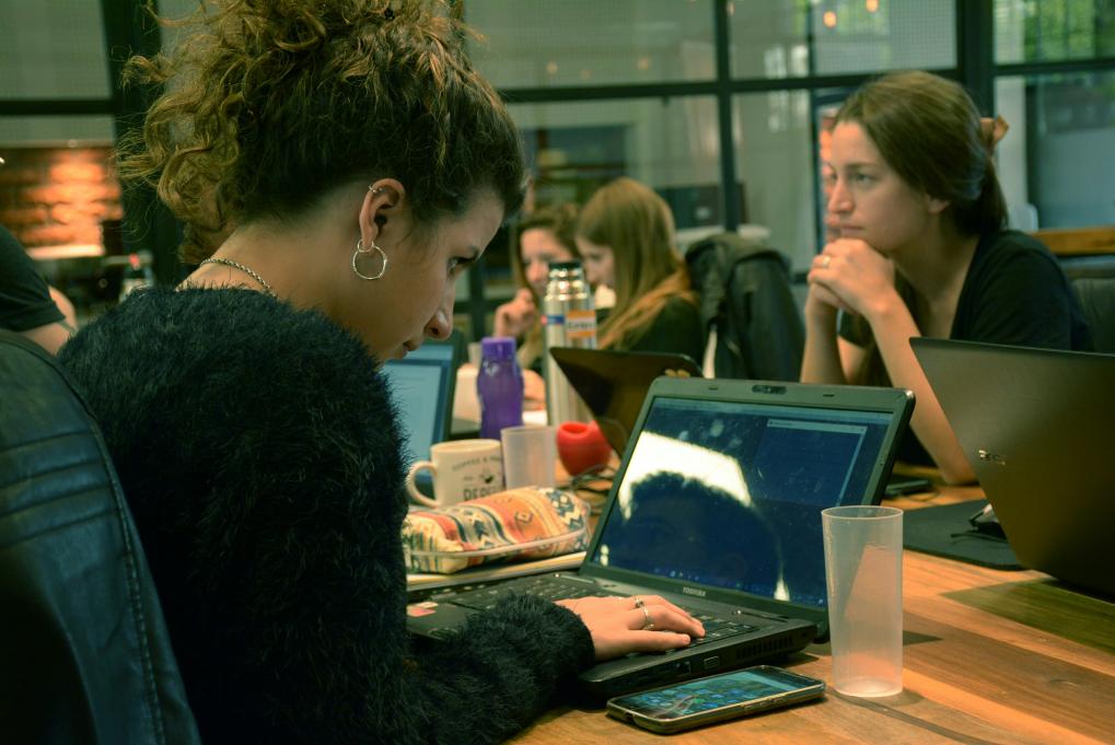A woman working on a laptop. 