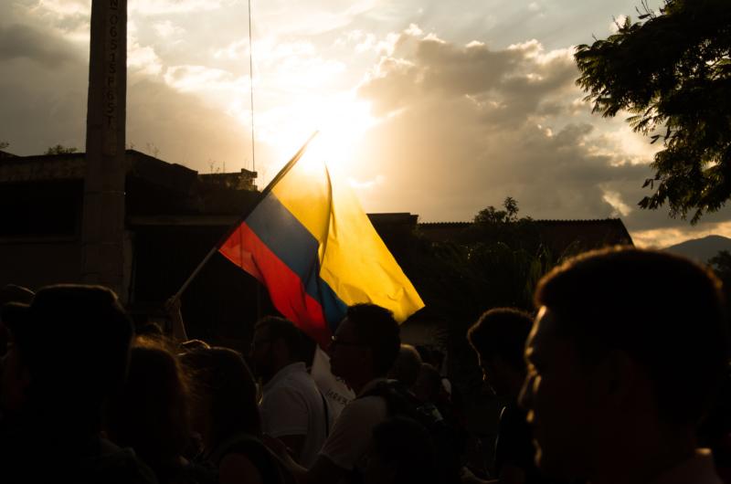 protesters holding Colombian flag