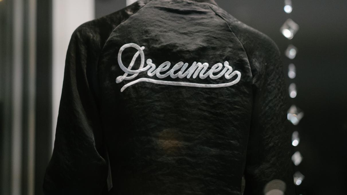 The back of a jacket that says "dreamer"