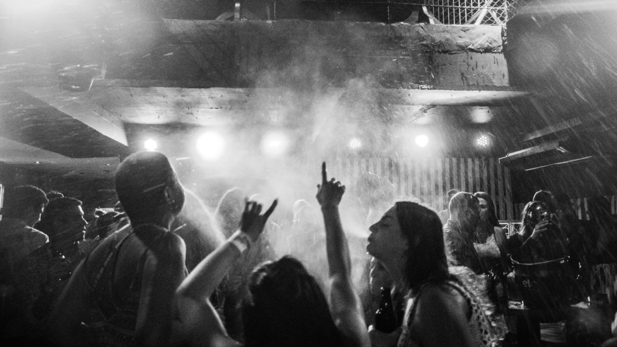 black and white photo of people in a night club