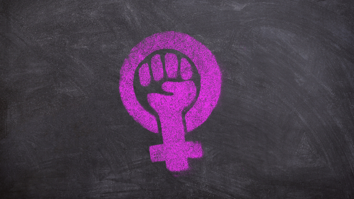 A pink feminist symbol on a gray background